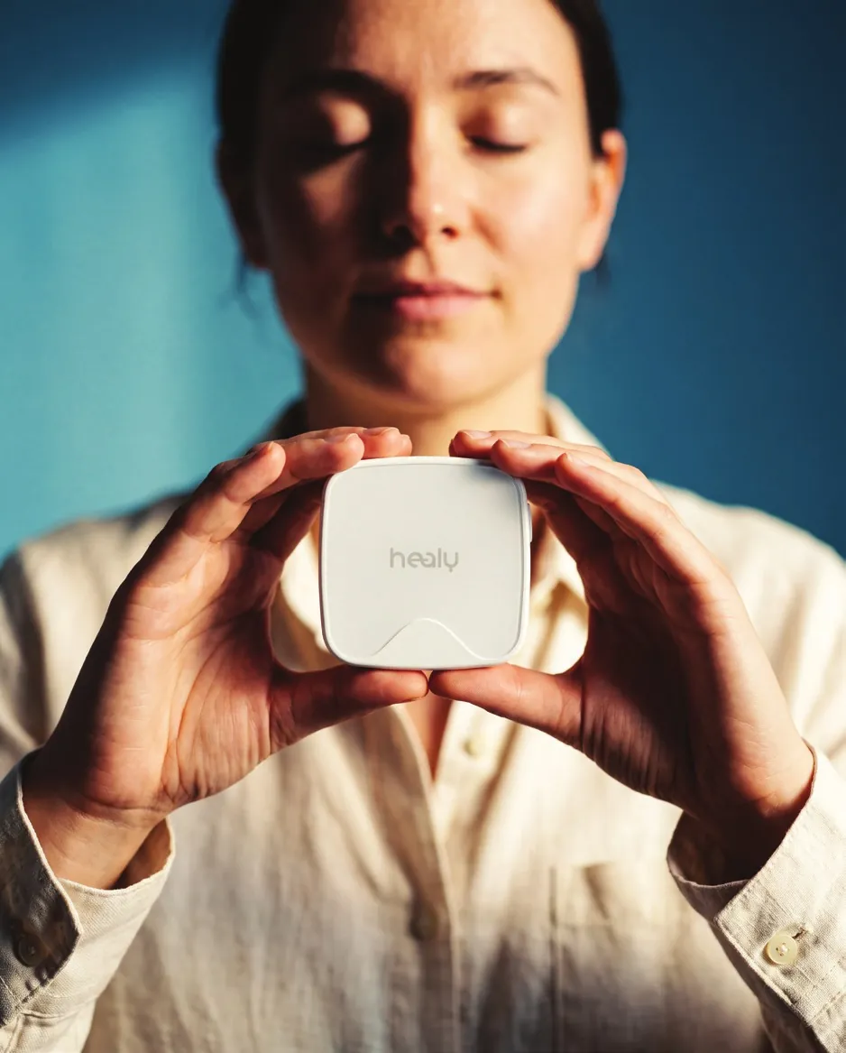 A woman holding Healy 3 in both hands