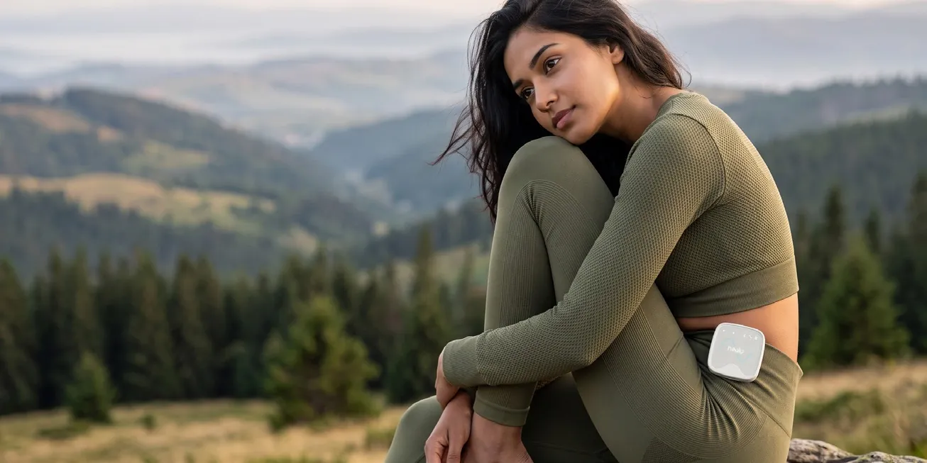 A woman resting in the mountains wearing Healy 3